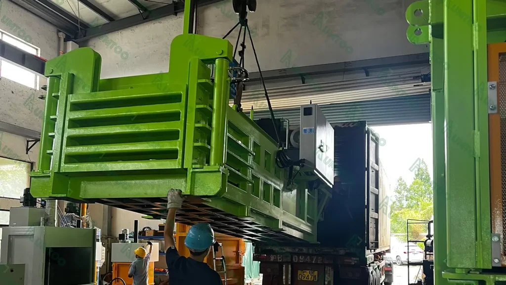 Worker operating industrial machinery installation.