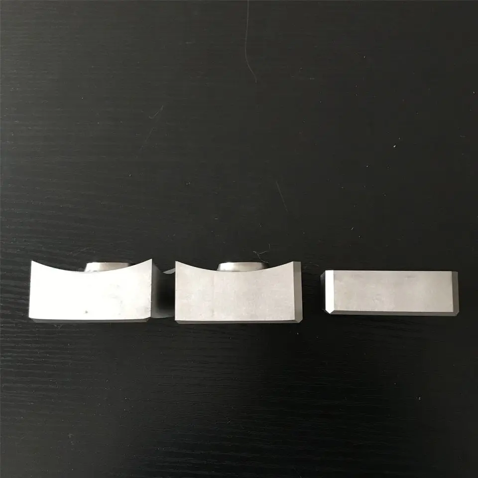 Multiple shredder knives arranged in a pattern.