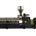 A high-performance co-rotating twin-screw extruder. The machine features a long, horizontal design with multiple heating zones, a large hopper for material feeding at the top, and a powerful motor at the end. The extruder is designed for efficient and consistent processing of various materials, making it ideal for industrial applications such as plastics compounding, blending, and recycling. The extruder's robust construction and advanced technology ensure high output and reliability.