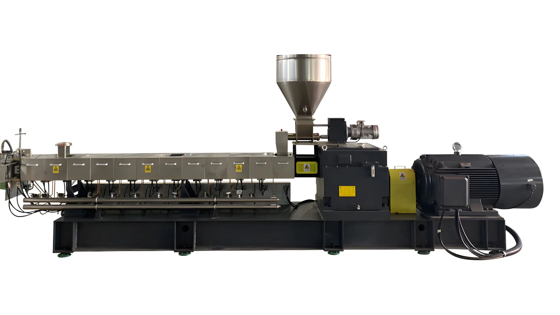 A high-performance co-rotating twin-screw extruder. The machine features a long, horizontal design with multiple heating zones, a large hopper for material feeding at the top, and a powerful motor at the end. The extruder is designed for efficient and consistent processing of various materials, making it ideal for industrial applications such as plastics compounding, blending, and recycling. The extruder's robust construction and advanced technology ensure high output and reliability.