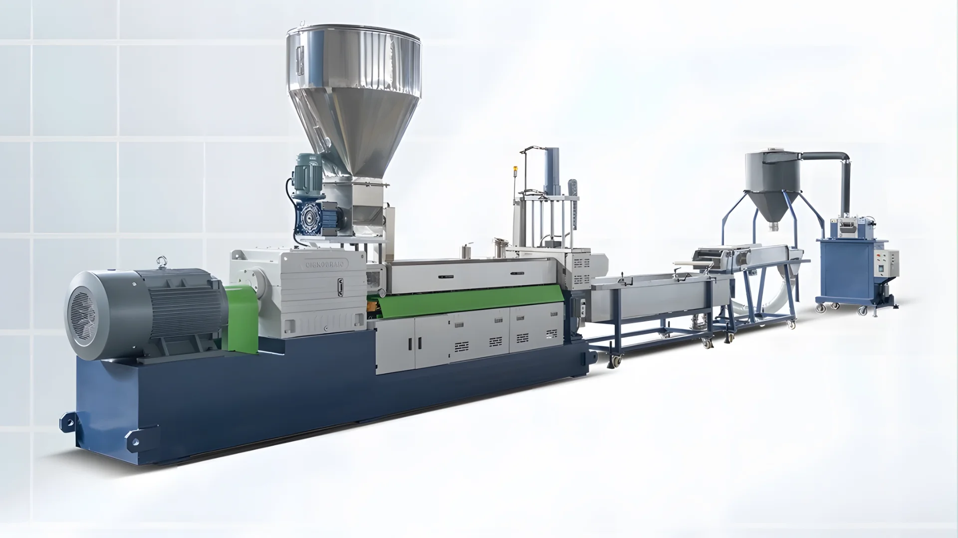 The image shows an industrial plastic extrusion line. This machinery is used for the production of plastic products by melting raw plastic material and forming it into a continuous profile. The equipment includes various components such as a hopper for raw material input, an extruder where the plastic is melted and pushed through a die to shape it, cooling systems, and possibly cutting or rolling mechanisms for the final product handling. The setup is typically used in manufacturing processes for creating plastic pipes, sheets, films, and other profiles.