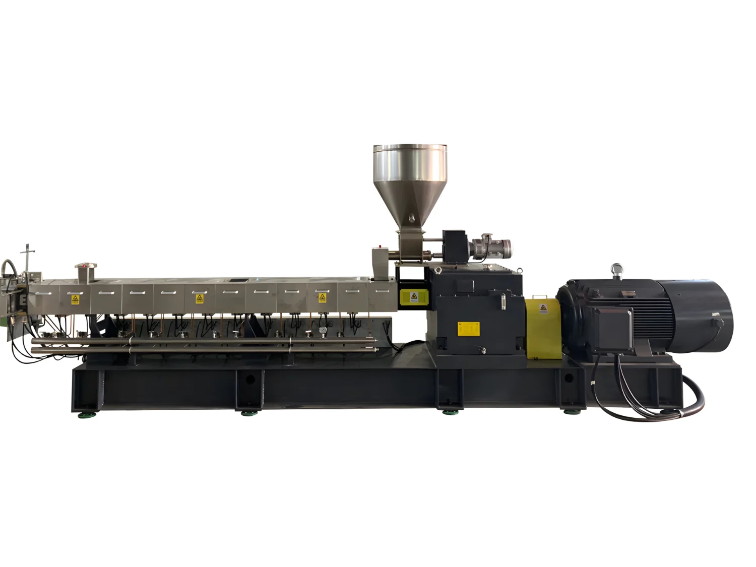 The image shows an industrial machine, which appears to be a plastic granulator or extrusion machine. This equipment is commonly used in the plastic processing industry for recycling or creating plastic pellets. It includes components like a hopper for feeding plastic material, an extrusion chamber, and a motor, which drives the extrusion process. The processed plastic is typically melted, extruded, and formed into pellets or other shapes.