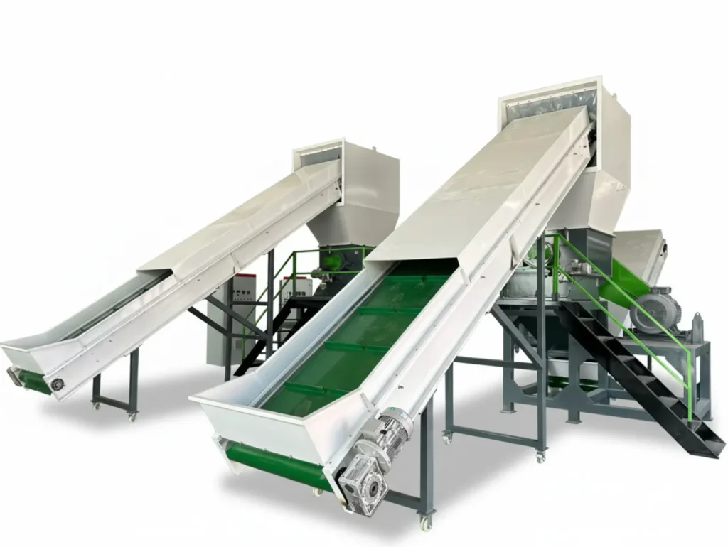 Industrial belt conveyor transporting shredded plastic for recycling