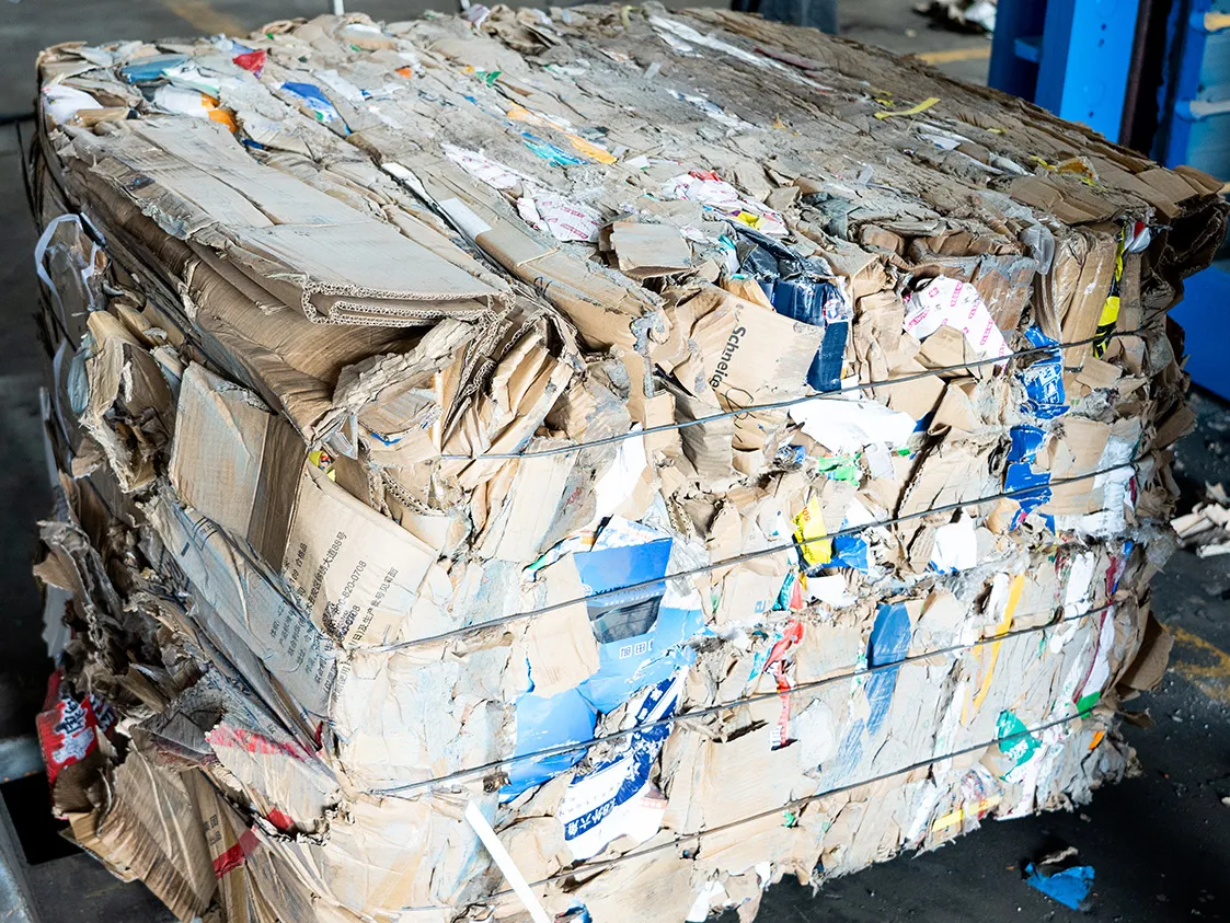 High-density compacted OCC cardboard bale tied with galvanized wire from horizontal baler